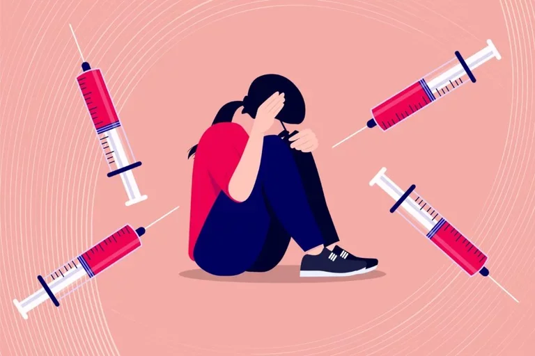 image of woman holding her heard in distress with vaccines around her